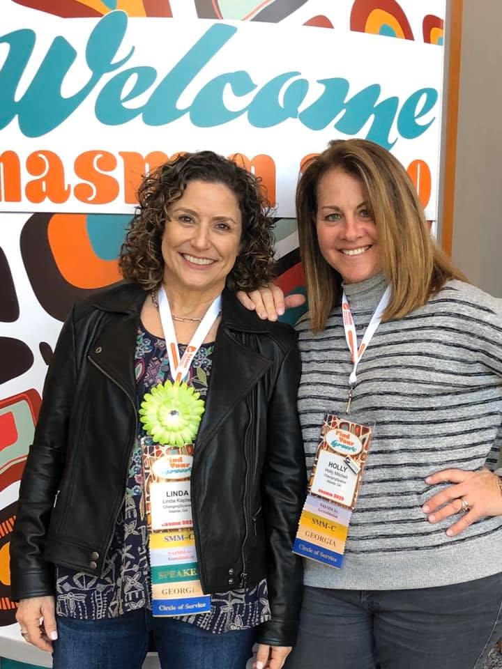Two professional home organizers from ChangingSpaces Atlanta smiling together at an industry event